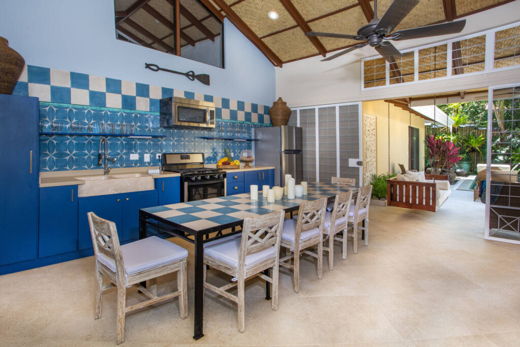 The kitchen and dining area are just steps away from the pool and deck. 