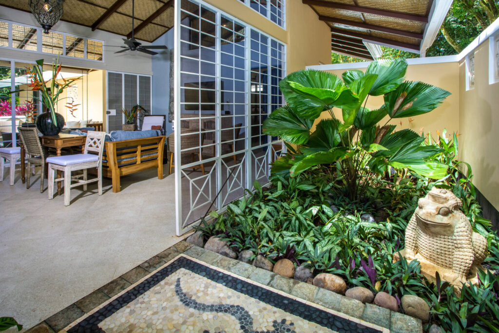 A tropical garden and large sliding screened doors make your entrance to the villa a memorable experience. 
