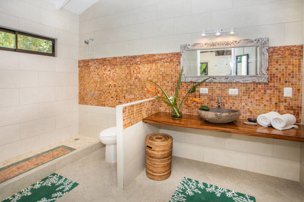 Imported tiles and high ceilings help to create an incredible ensuite bathroom design. 