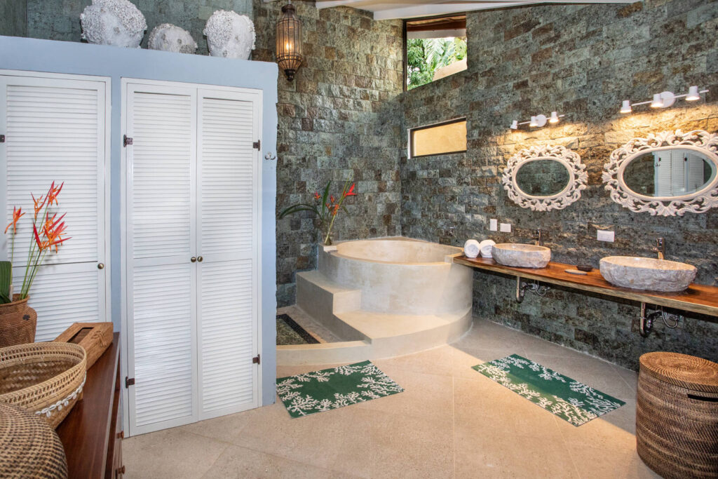 The incredibly-designed master bathroom features a large soaking tub to enjoy after a fun-filled day in Manuel Antonio. 