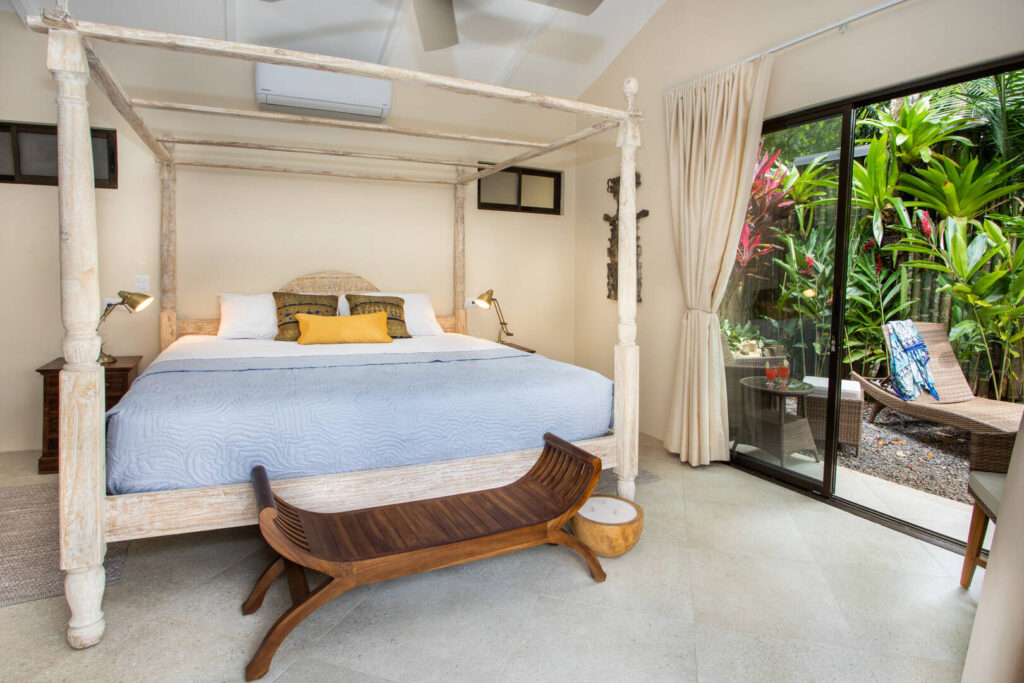 Step out of the sliding glass doors to a private sunbathing area from this luxury king bedroom. 