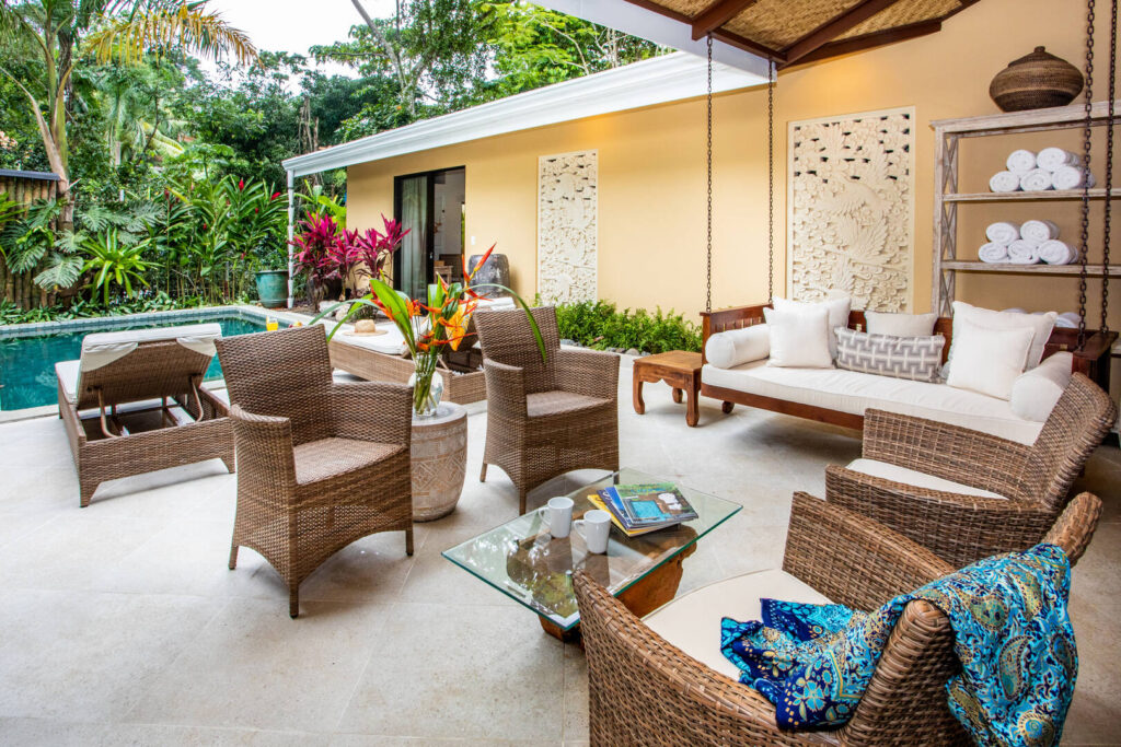 This cozy sitting area on the pool deck is a wonderful space to entertain or enjoy a cold drink. 