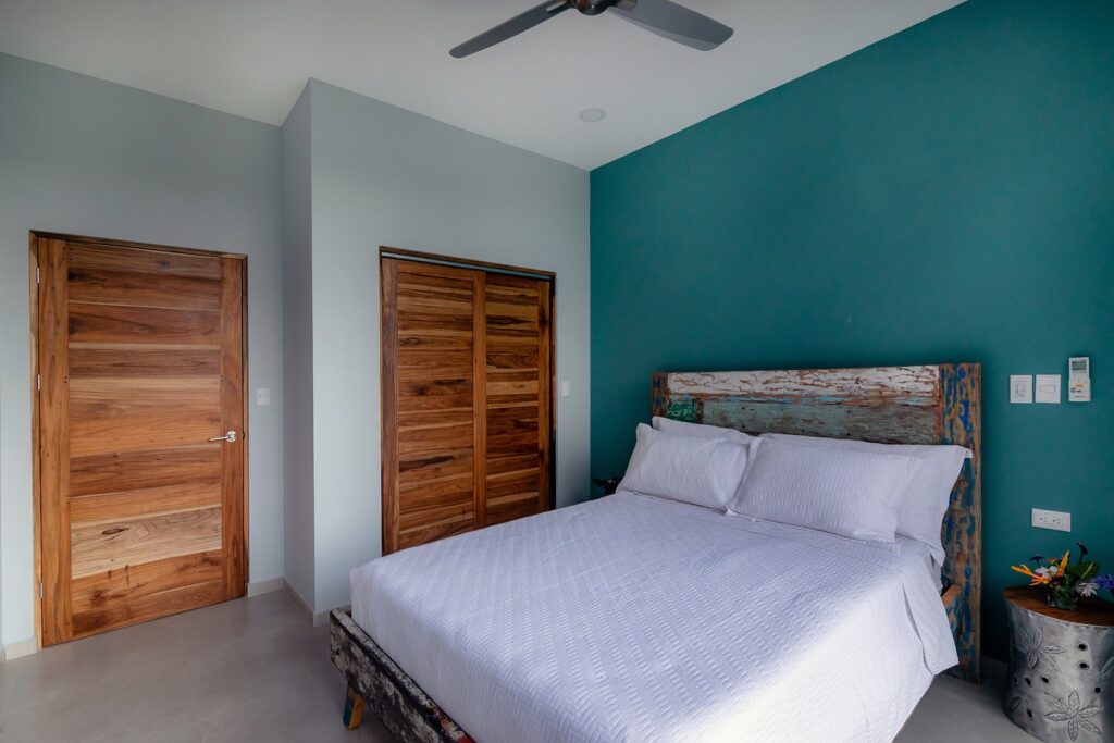 The bedrooms are cool and relaxing shades of blue accented with bold natural wood features.