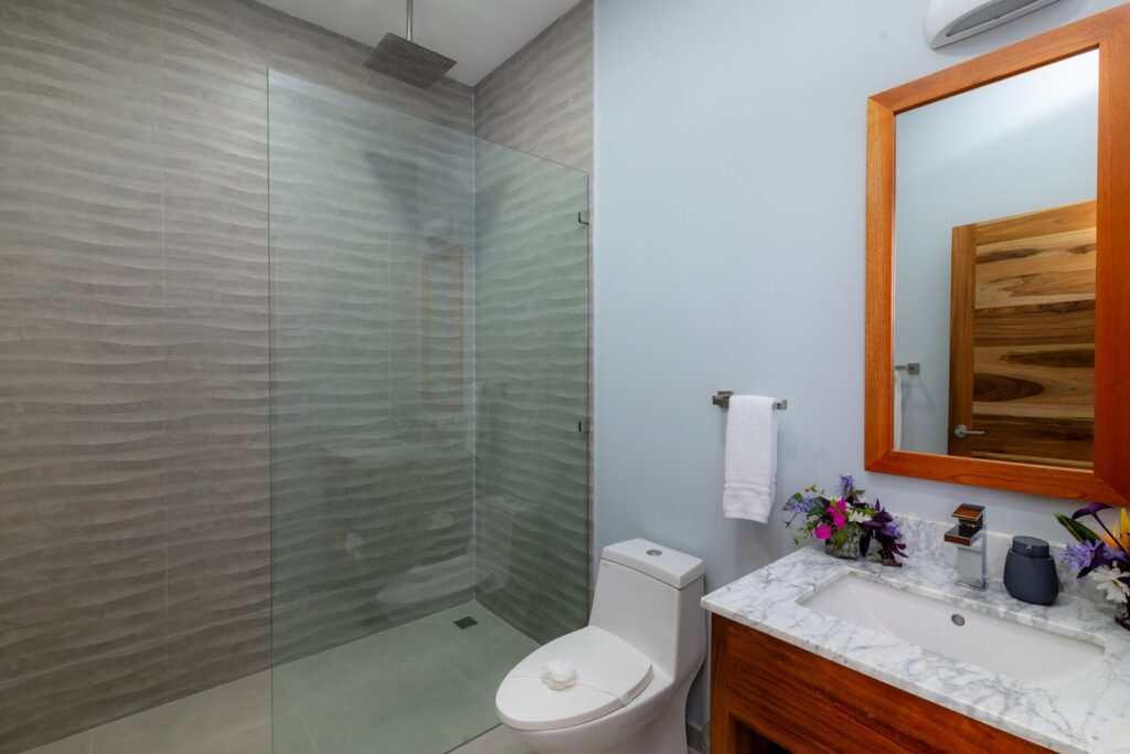The decor of the bathrooms gives them a distinct simple yet luxurious vibe.