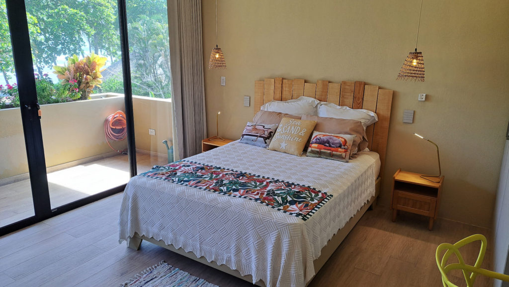 Beautifully furnished bedroom, adorned with natural wood touches.