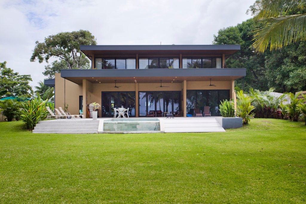 Modern beach front Costa Rica vacation villa with a private pool and tropical gardens.