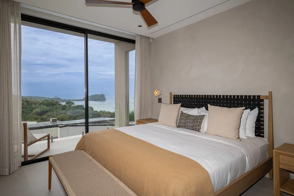 The view from this elegant master bedroom features the Cathedral Point in the Manuel Antonio National Park.