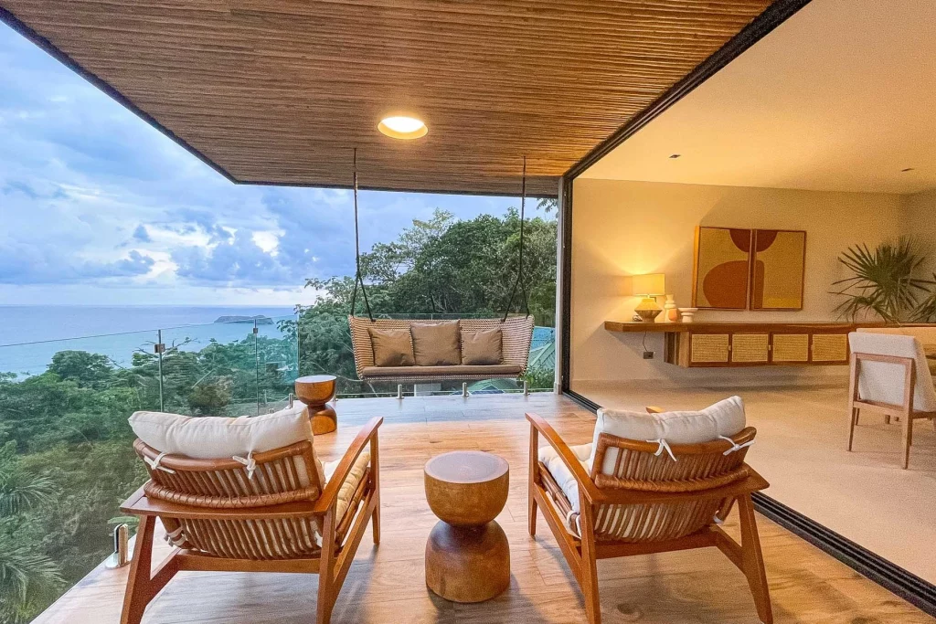 This incredible Manuel Antonio luxury vacation villa is tucked into the rainforest, boasting numerous balconies with panoramic views.