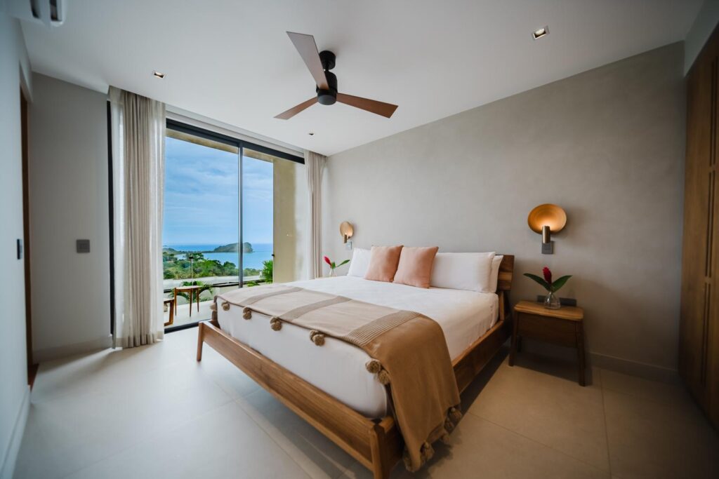 Soft tones, natural light, and a view that opens to the ocean—rest here comes easy.