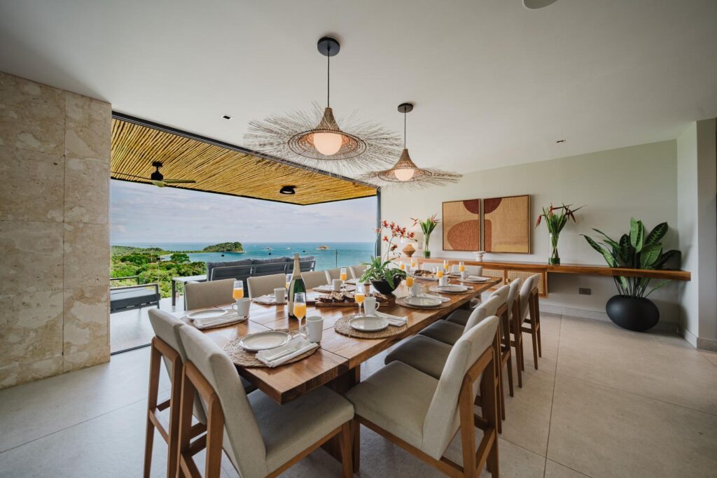 Gather around the table with the ocean just beyond—meals here are shared with a view.