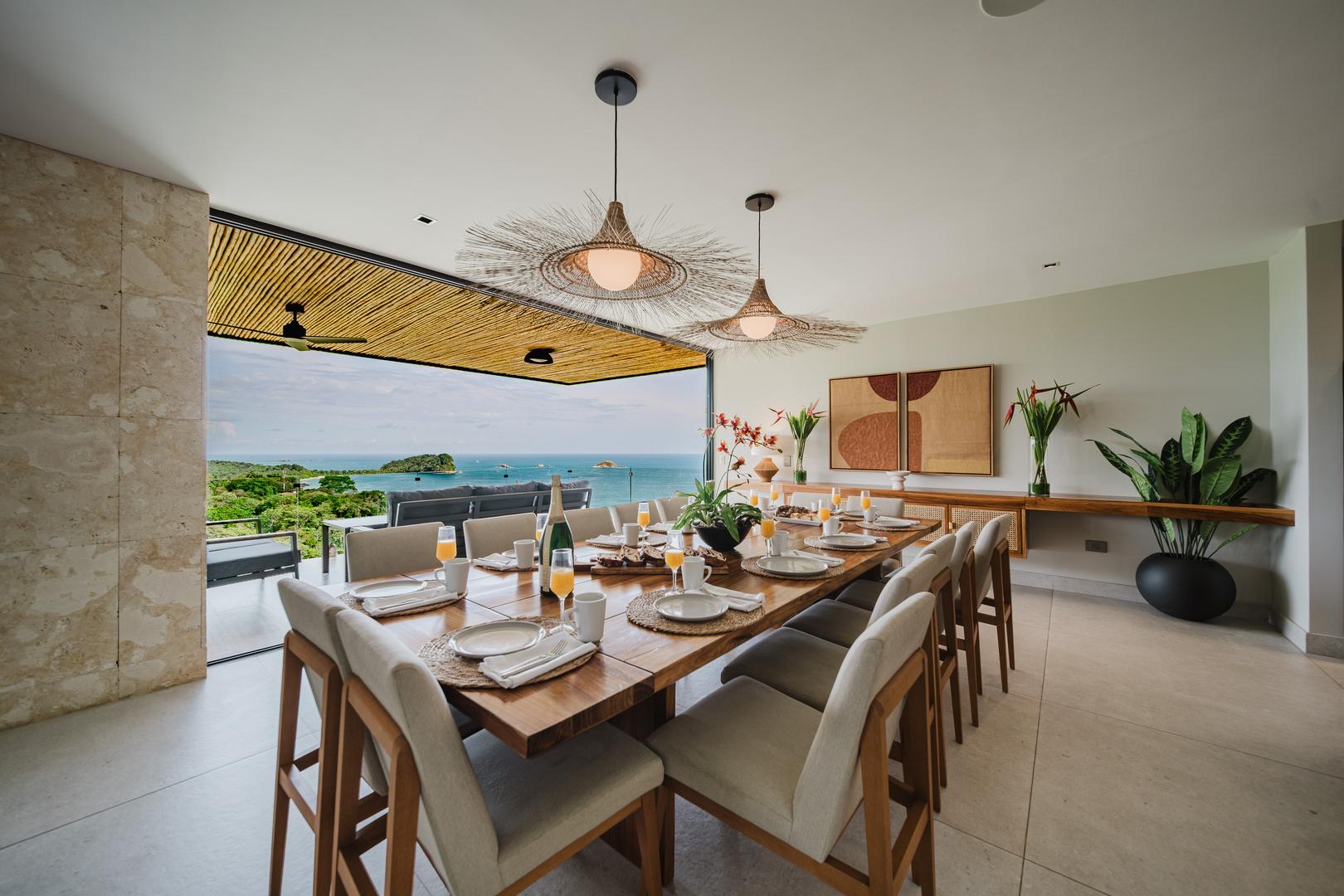 Dining room with long table and ocean view in Manuel Antonio Costa Rica