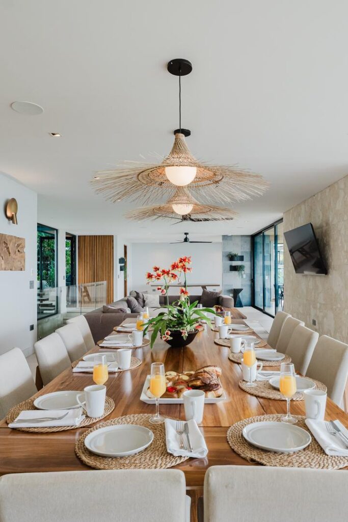 A beautifully set dining table in a bright, open-concept living space.