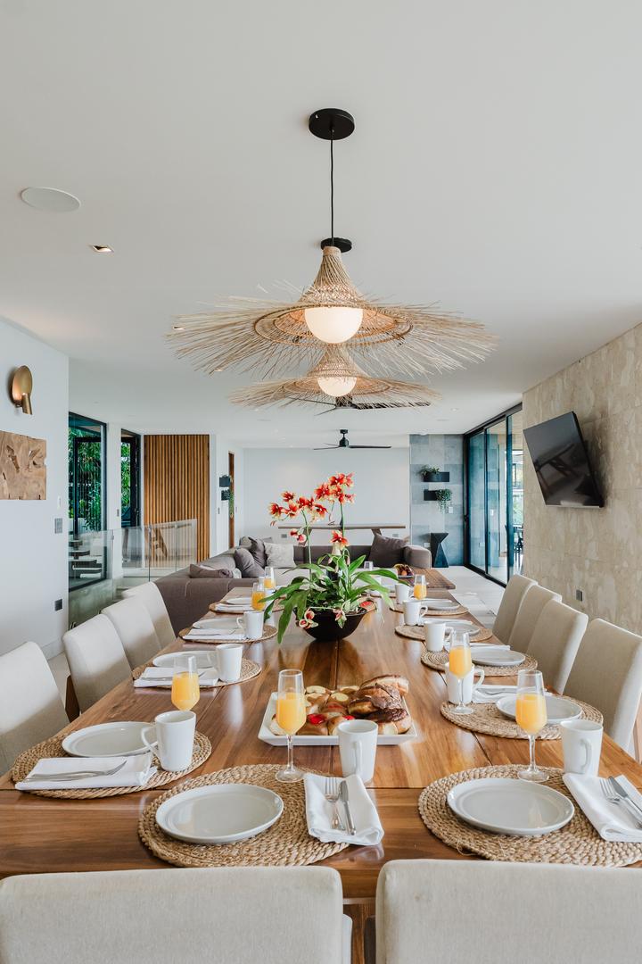 Indoor dining table set for breakfast in modern open living area Manuel Antonio Costa Rica