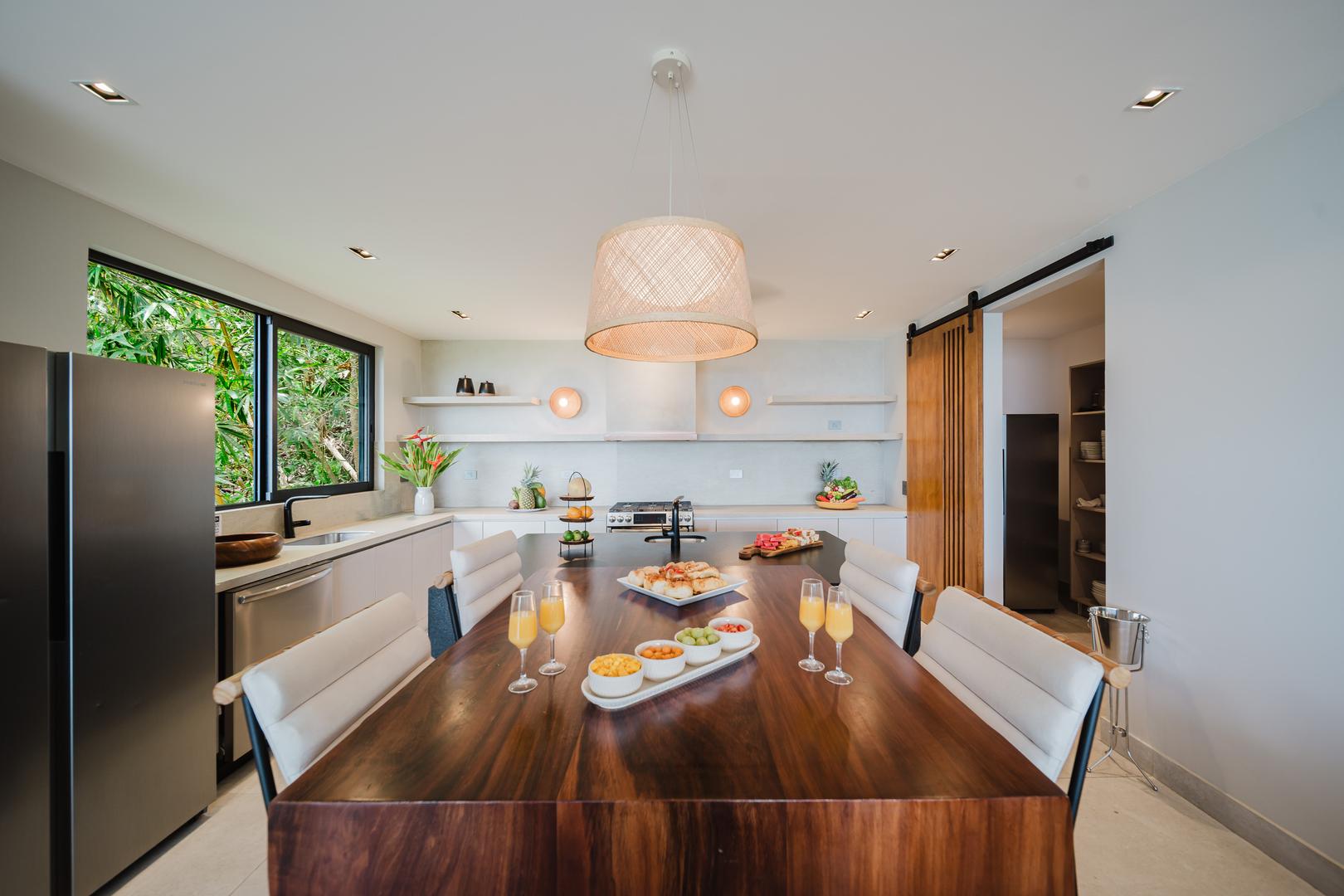 Kitchen island with dining seating and modern appliances in Manuel Antonio Costa Rica