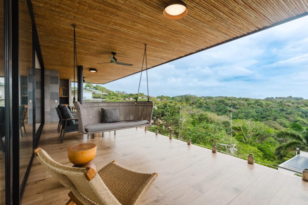 A breezy covered terrace with sweeping jungle views, made for quiet moments and effortless relaxation.