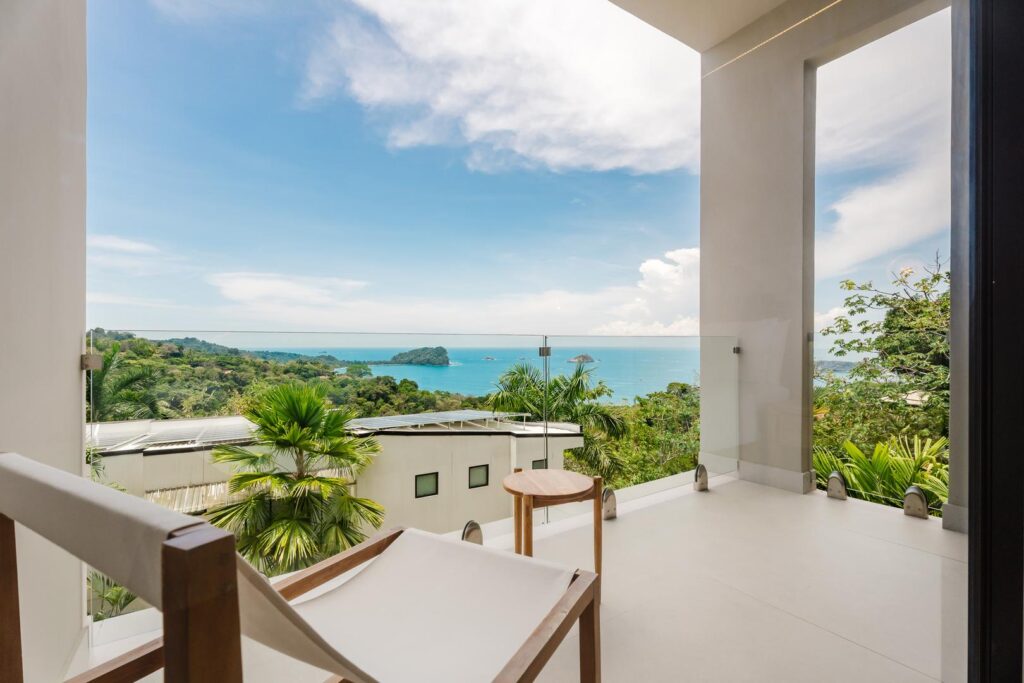 A quiet balcony with nothing but ocean ahead—your own space to sit, pause, and take it all in.