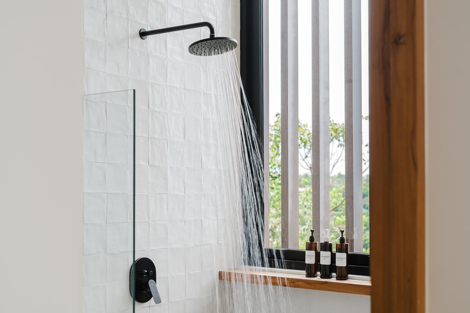 Modern bathroom with rainfall shower and window light in Manuel Antonio Costa Rica