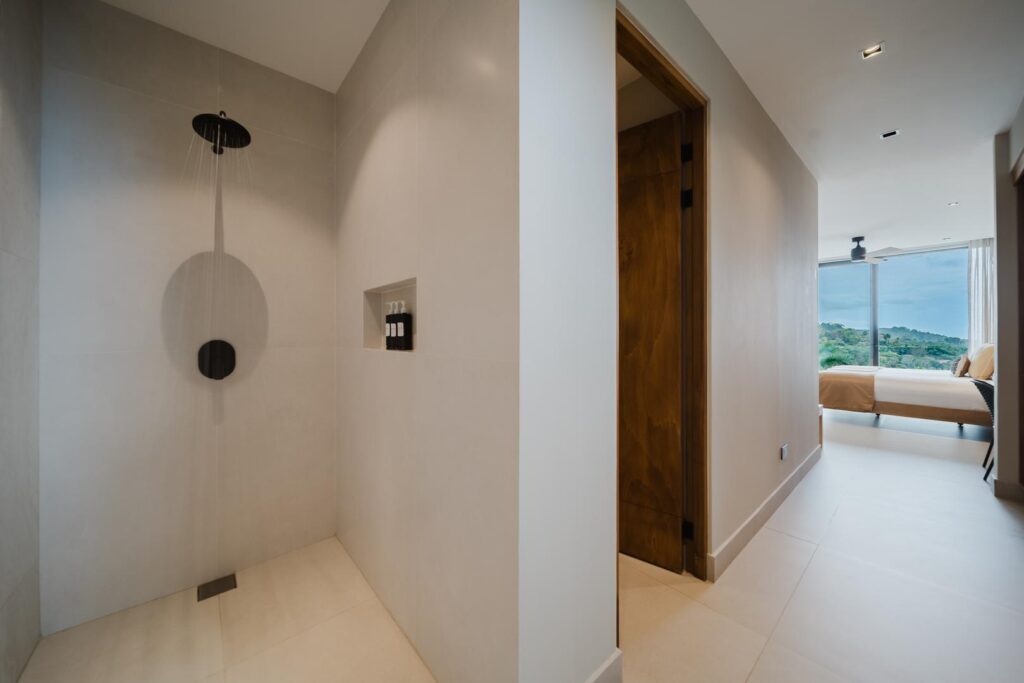 A seamless connection between bedroom and bath—clean design, soft tones, and space that feels effortlessly calm.