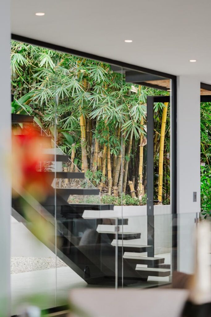 Architectural details that stand out—clean lines, open structure, and a connection to the surrounding greenery.