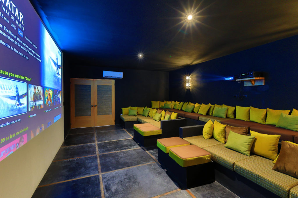 Indulge in movie nights in the fully air-conditioned cinema, furnished with plush tiered sofa seating, a state-of-the-art digital projector, and provisions for snacks.