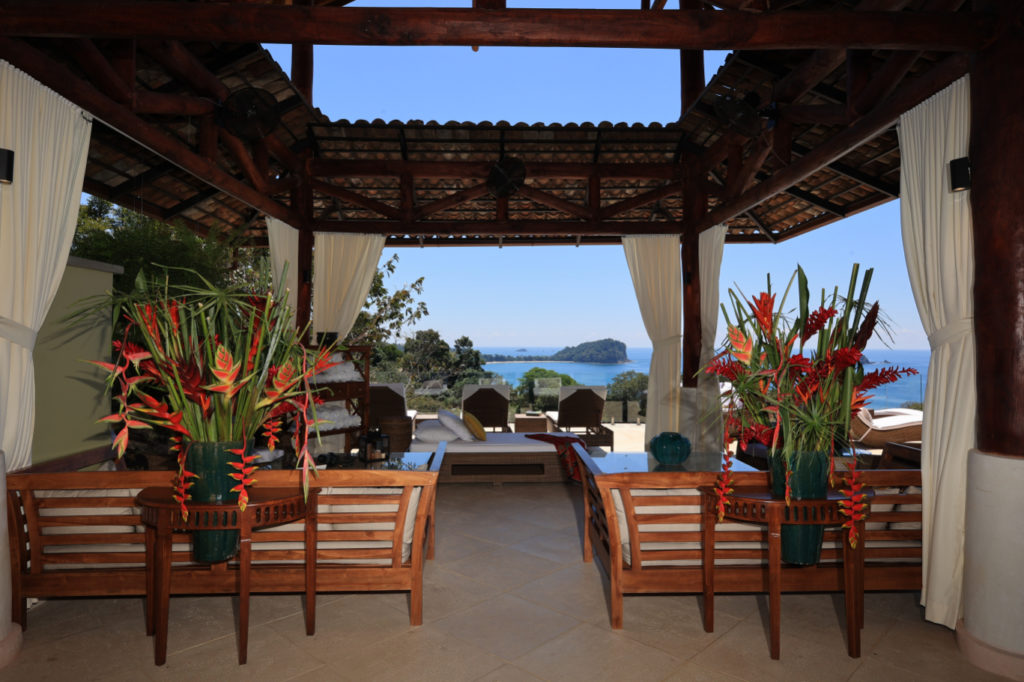 Expansive outdoor seating and lounge area, offering breathtaking ocean views.