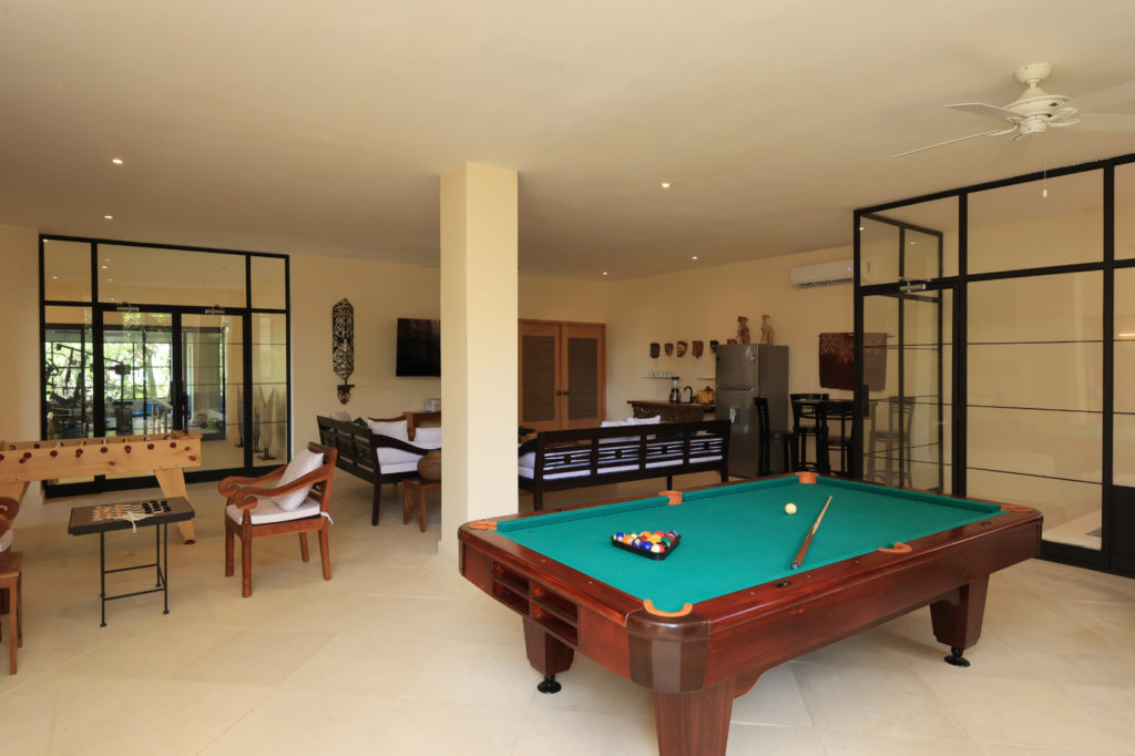 Our spacious, fully equipped entertainment area boasts a regulation-size pool table and foosball, complete with cozy seating and amenities for snacks.