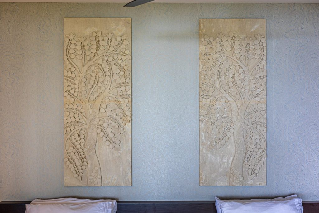 The attention to detail found in this villa is incredible, including these phenomenal hand-carved stone reliefs.