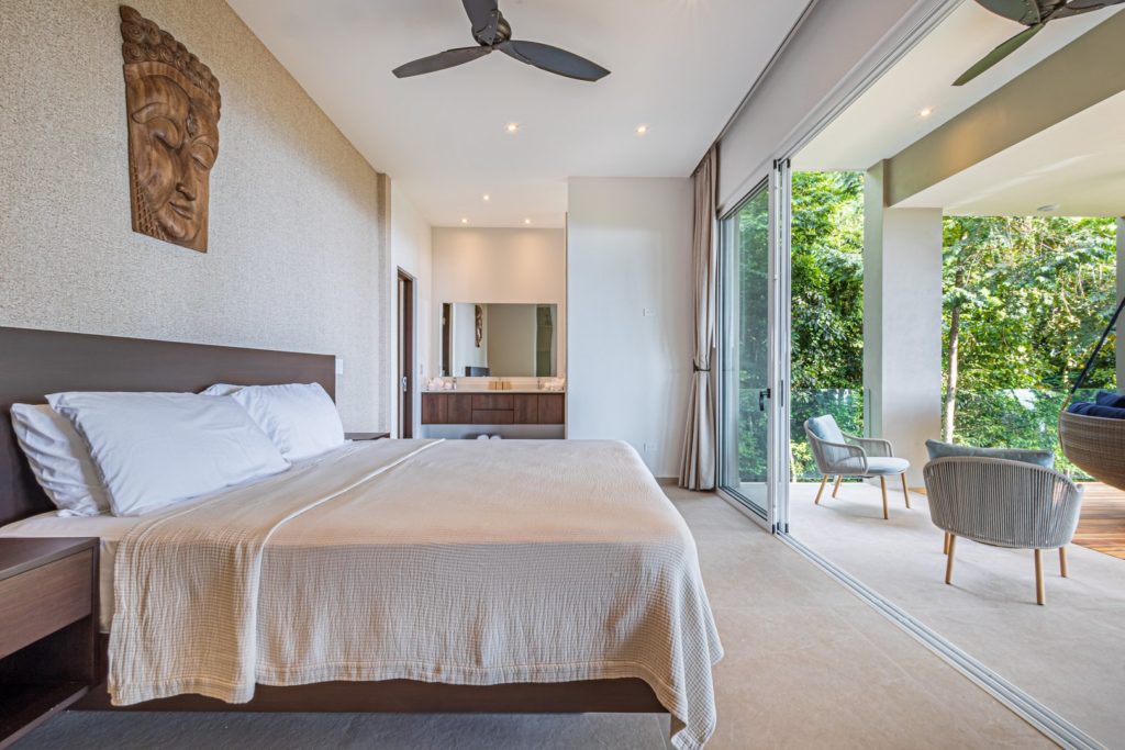 With the sliding glass doors open, the breeze can flow through and the bedrooms become even more spacious.