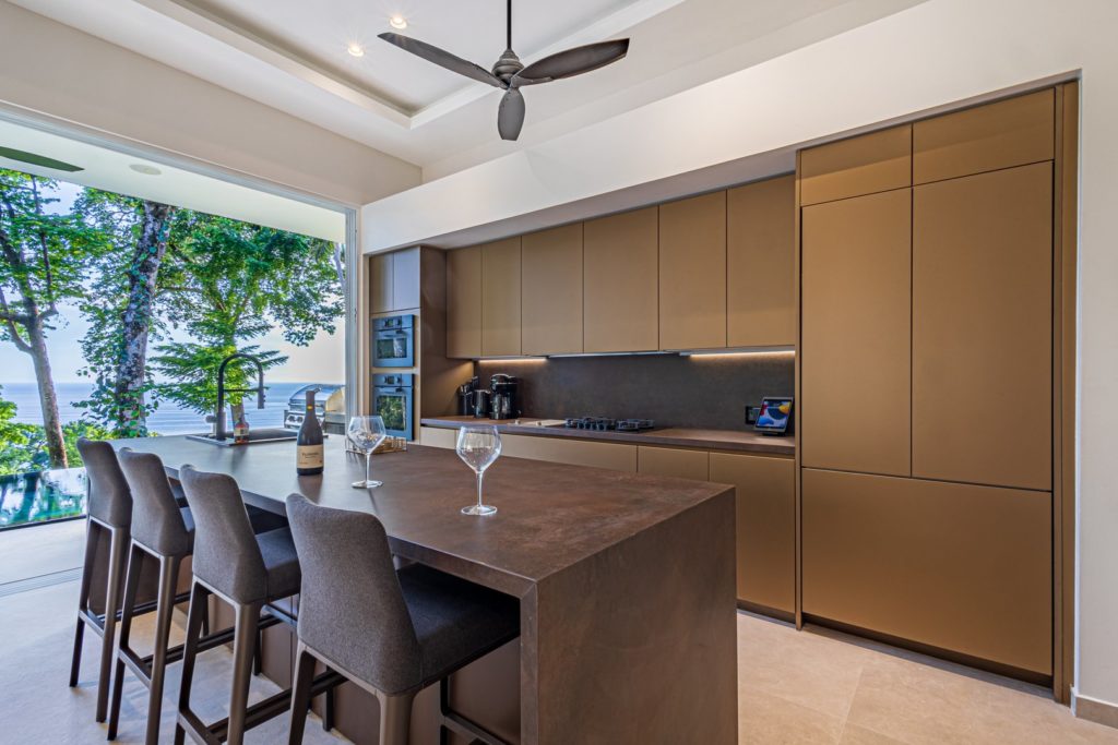 Step into this elegantly-crafted, contemporary kitchen with its inviting mocha hues that exude sophistication.