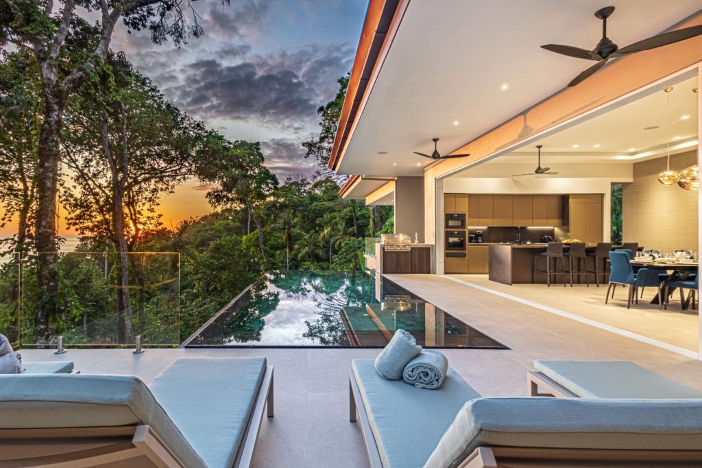 As the sun goes down, this stunning villa comes to life, glowing beautifully from within the jungle.