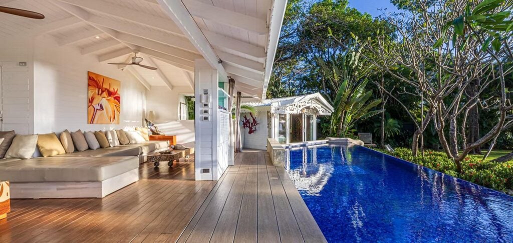 The refreshing pool is just steps away from the comfortable sitting area with its luxurious seating.