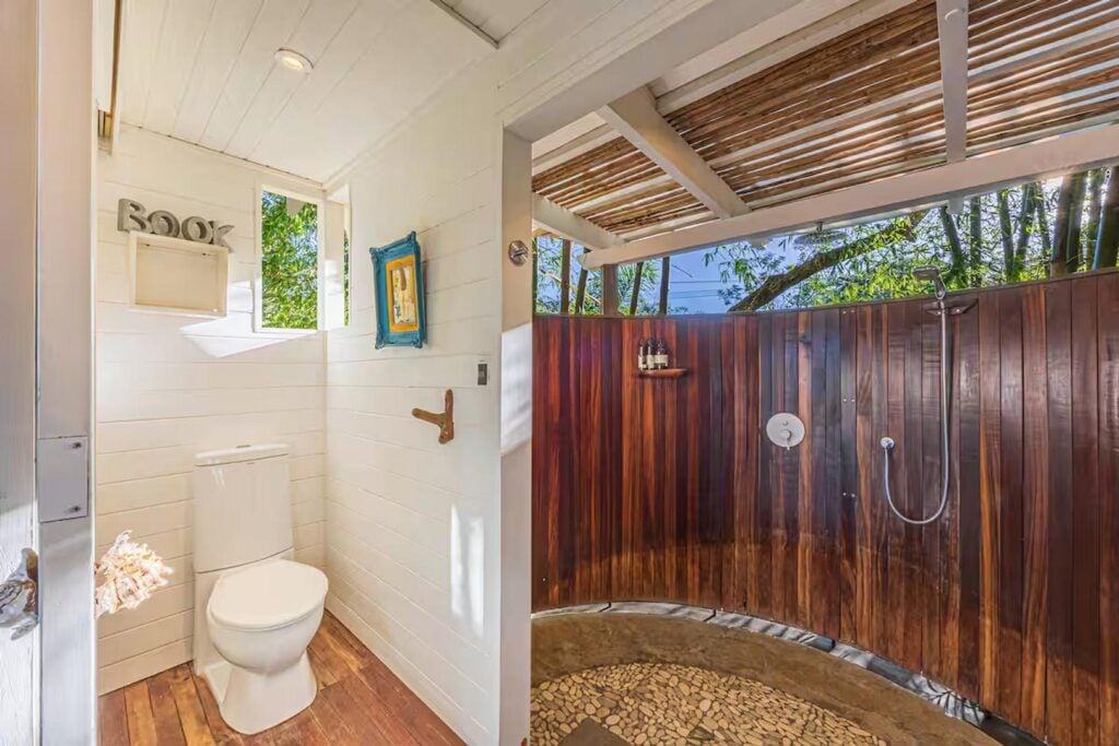 The master bathroom has a huge open-air shower for a true tropical rainforest experience.