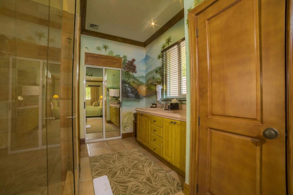 Many of the bedrooms and bathrooms have beautiful murals on the walls, a unique and interesting feature of this home.