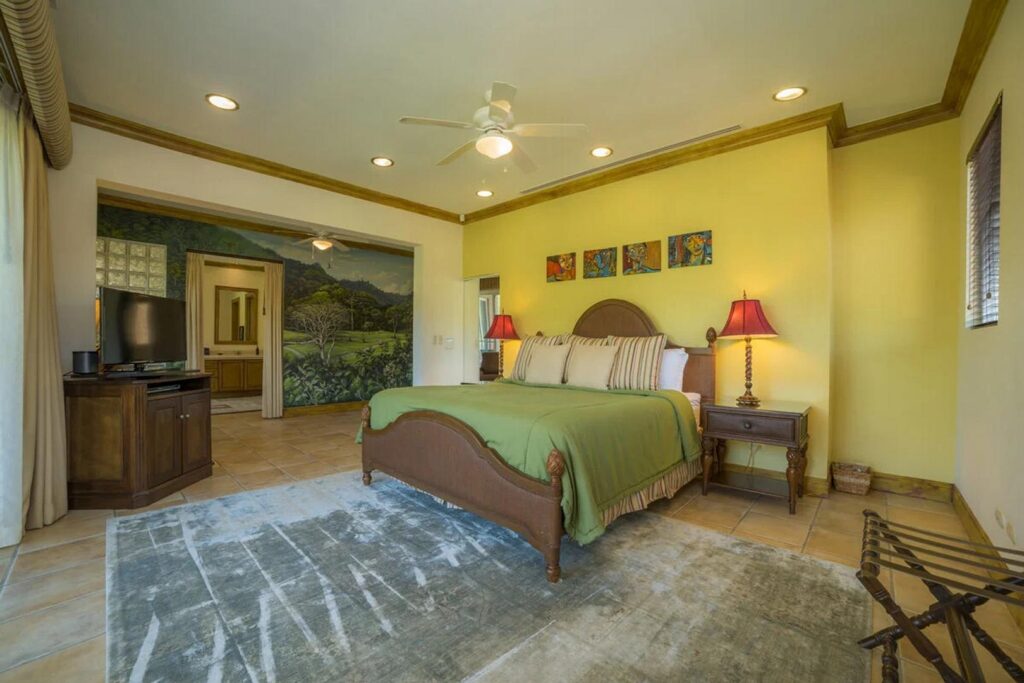 The very spacious master bedroom features a huge comfortable king bed.