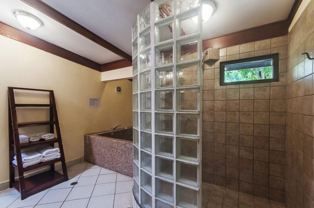 The master bath has a tub and a spacious walk-in shower.