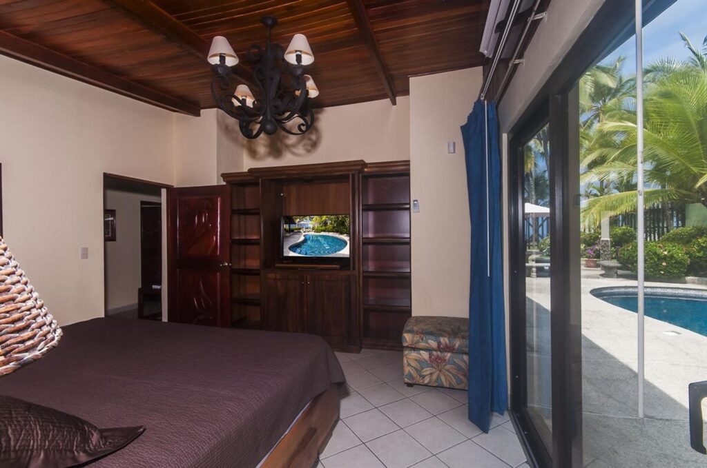 The master bedroom includes its own TV — perfect for quiet time and relaxation.