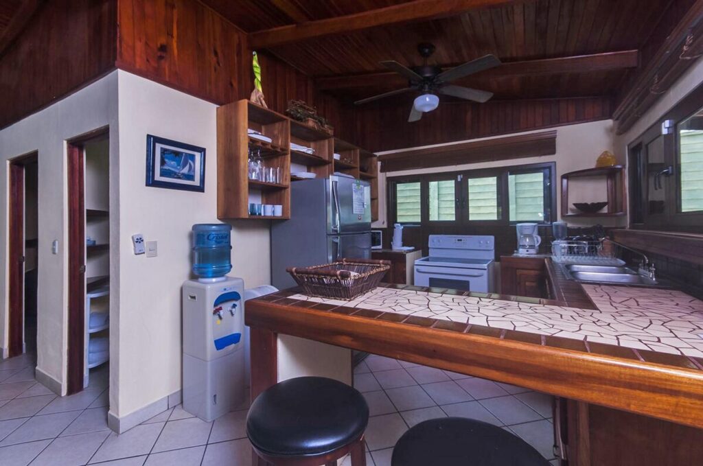 The kitchen features a cozy breakfast bar for quick bites.