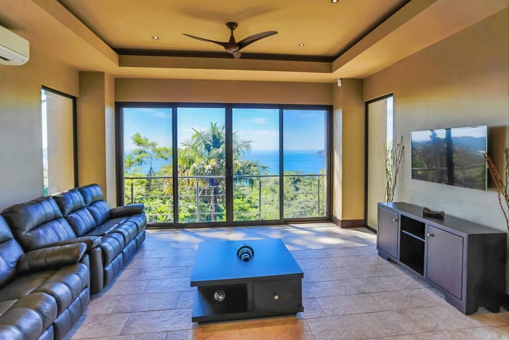 Movie nights meet breathtaking ocean views in the villa’s media room. Also 9th room option.