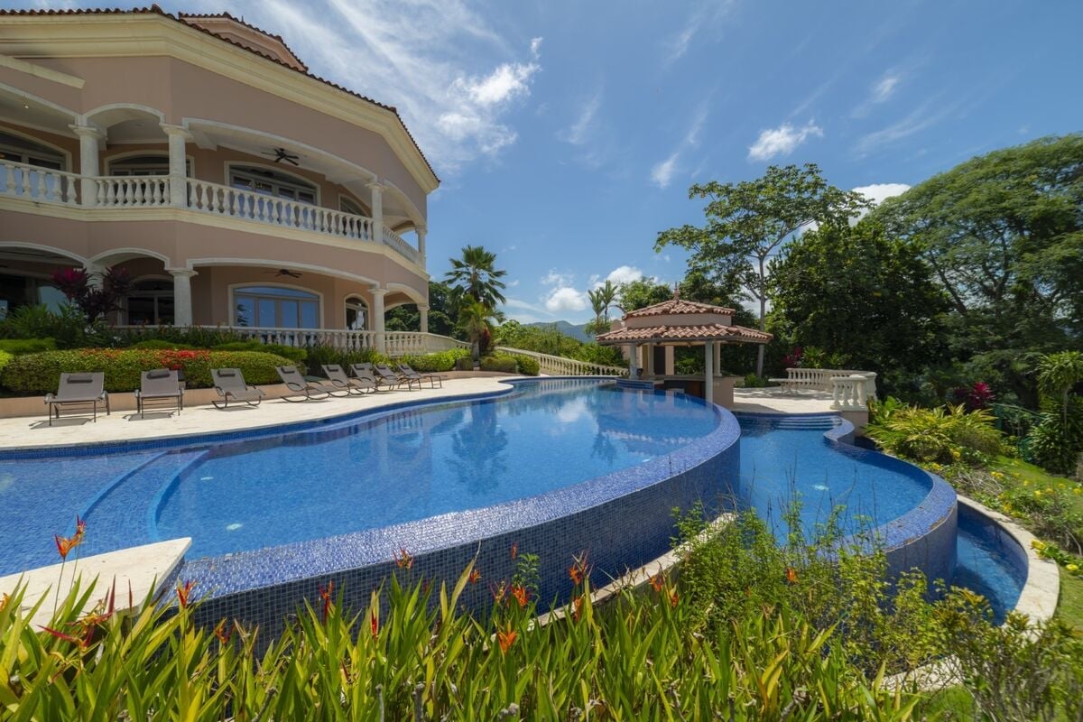 luxury villa in los suenos with infinity pool sun loungers terrace and tropical landscaping