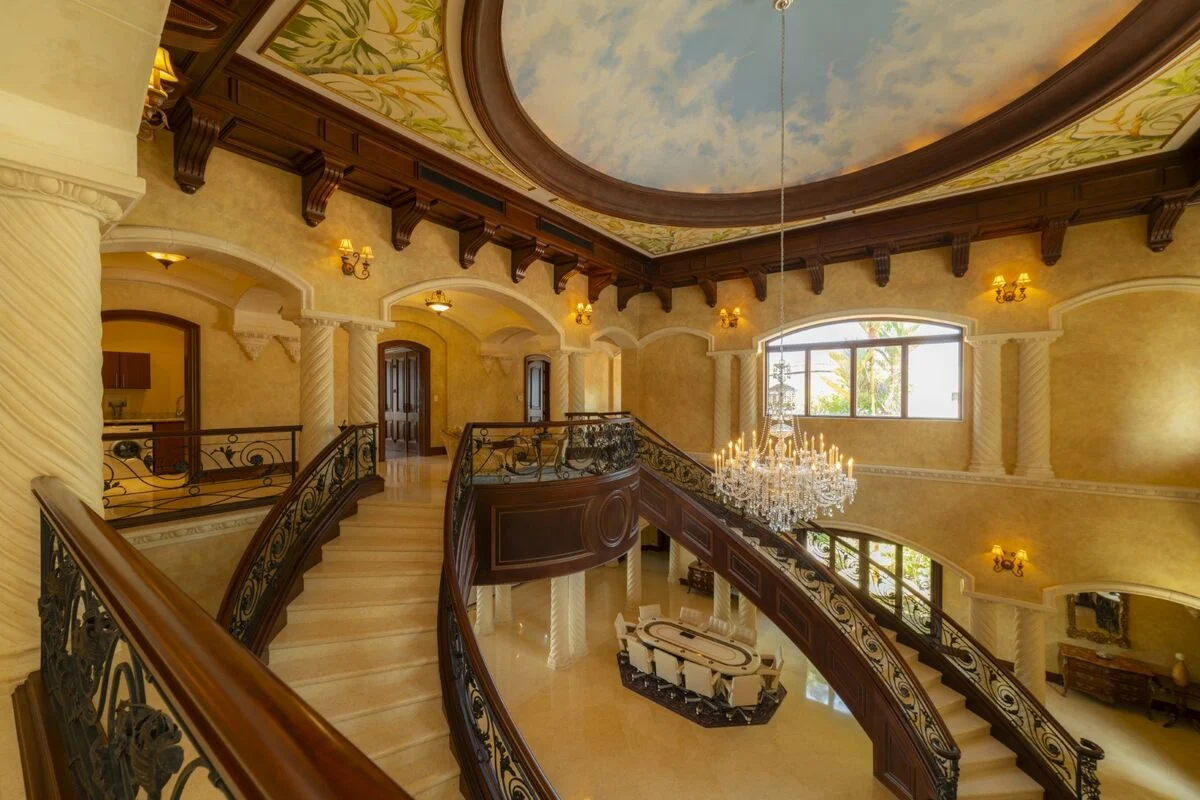 luxury villa interior with balcony view chandelier dome ceiling and detailed architecture in los suenos