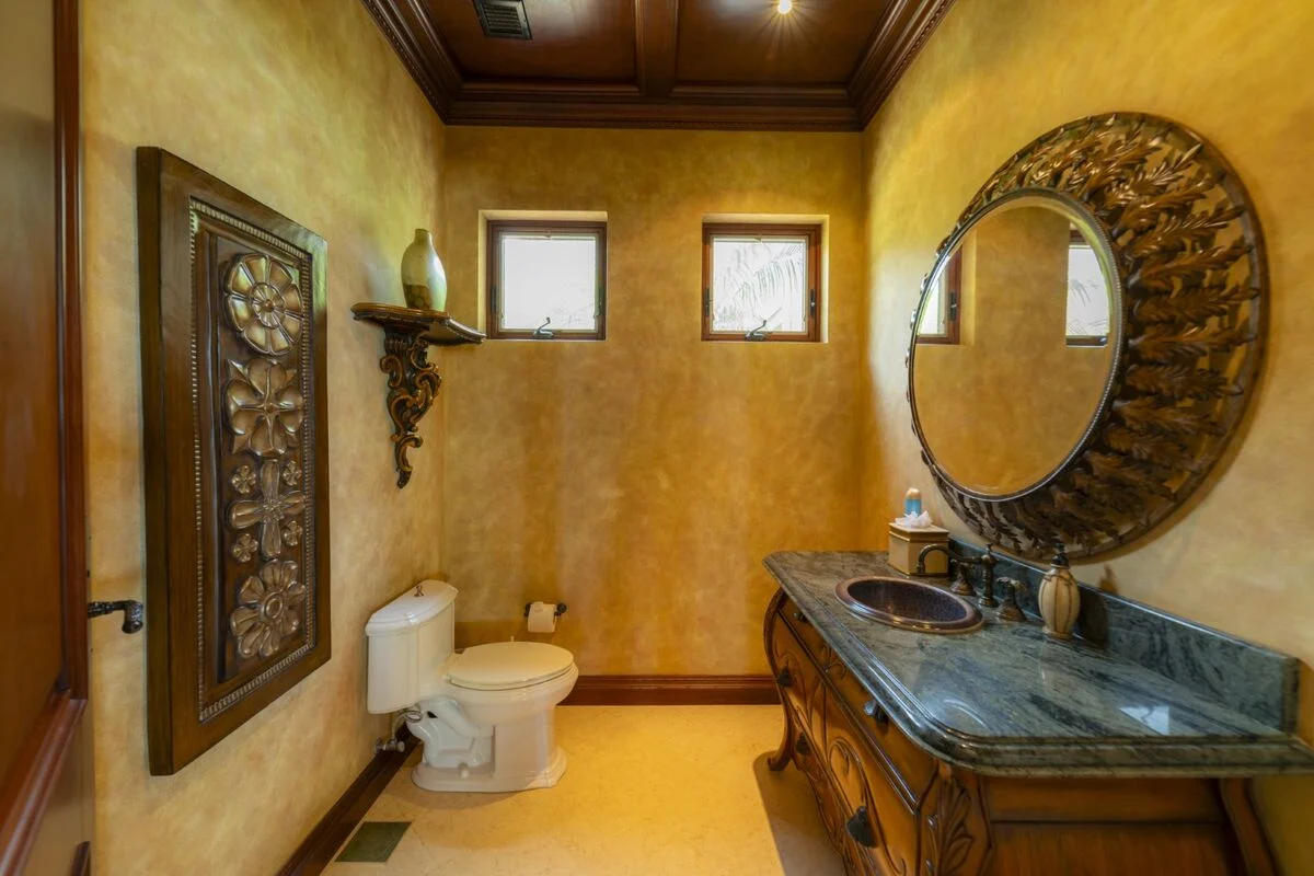 luxury villa powder room in los suenos with custom vanity mirror and decorative finishes