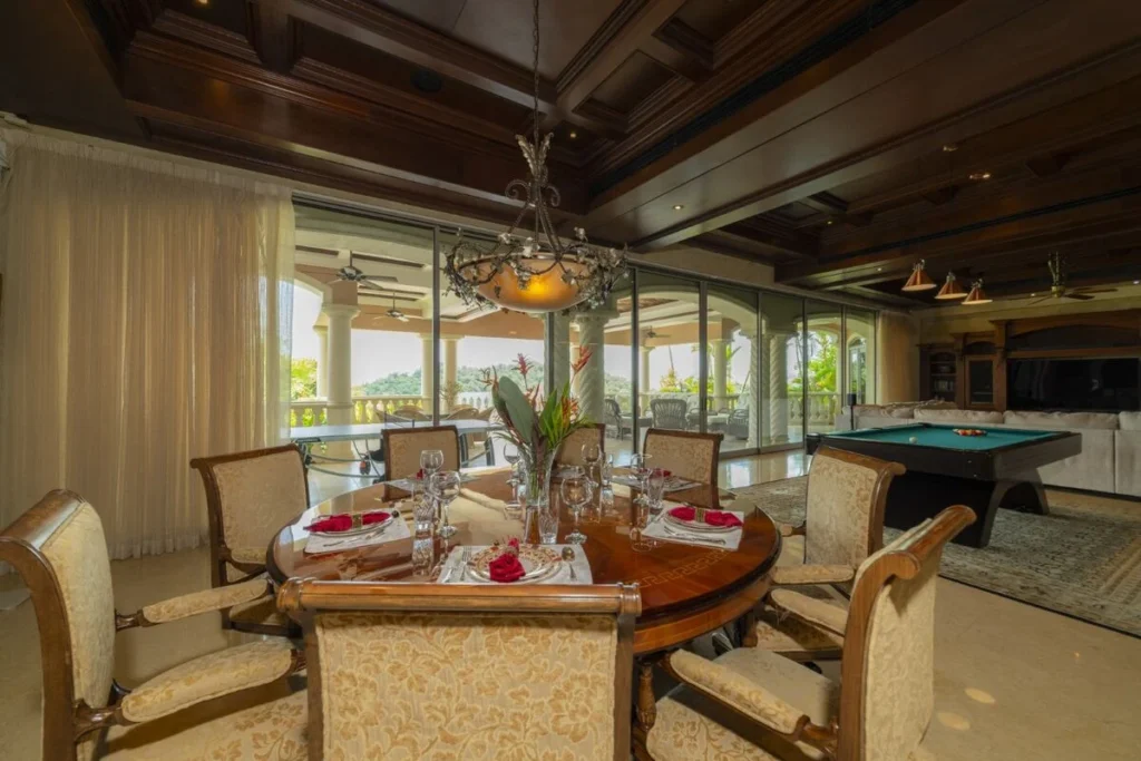 A refined dining space opens to the terrace, with indoor and outdoor living seamlessly connected for gatherings.