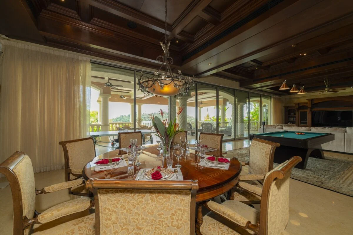 luxury villa dining room in los suenos with open terrace billiards table and large windows