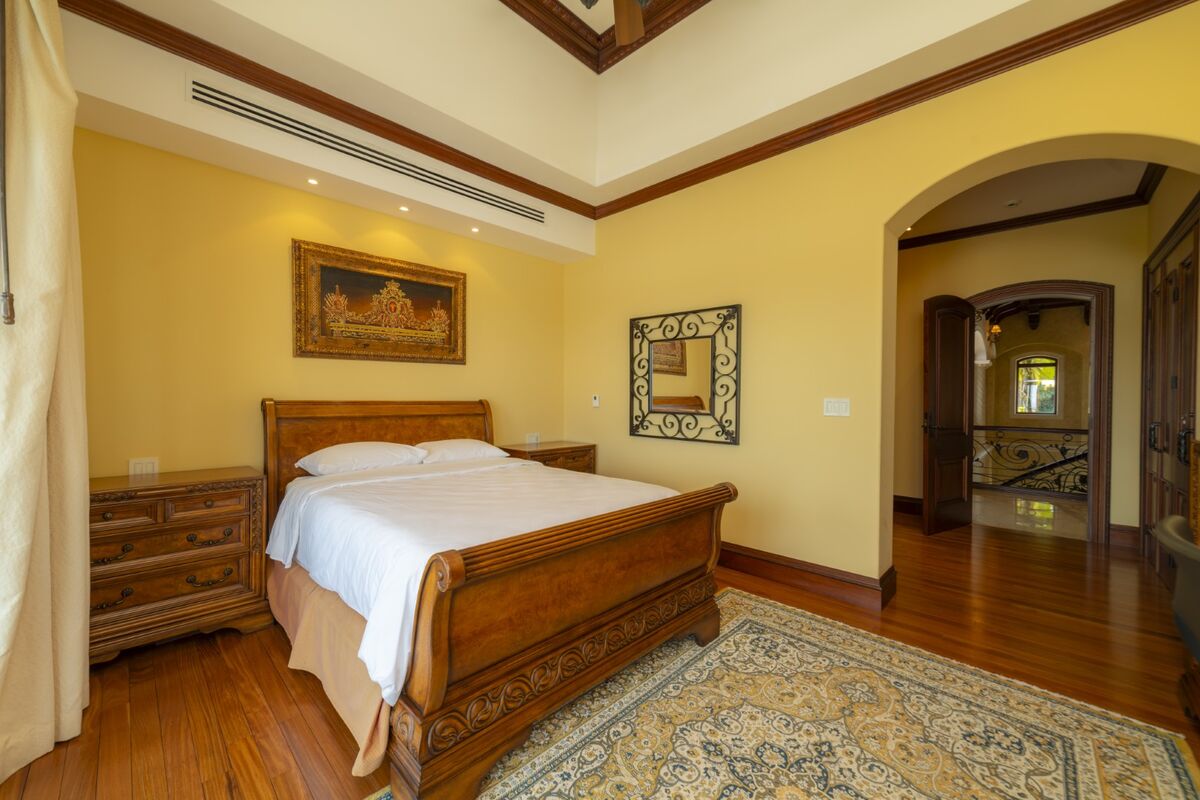 luxury villa bedroom in los suenos with wood flooring classic furniture and high ceilings