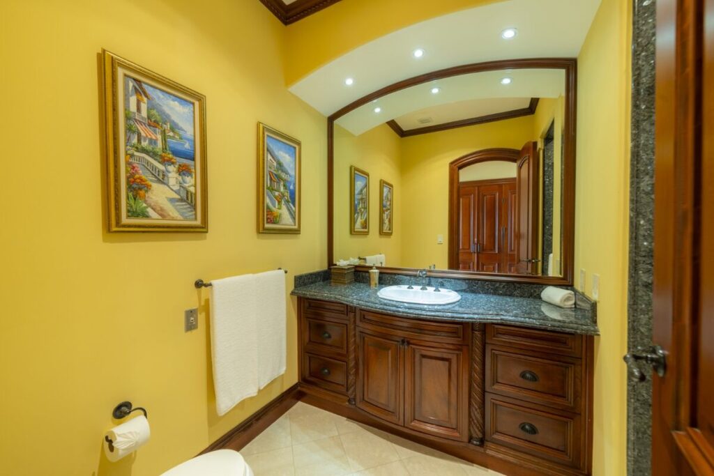 A well-appointed bathroom with custom cabinetry and granite countertops, combining function and refined design.