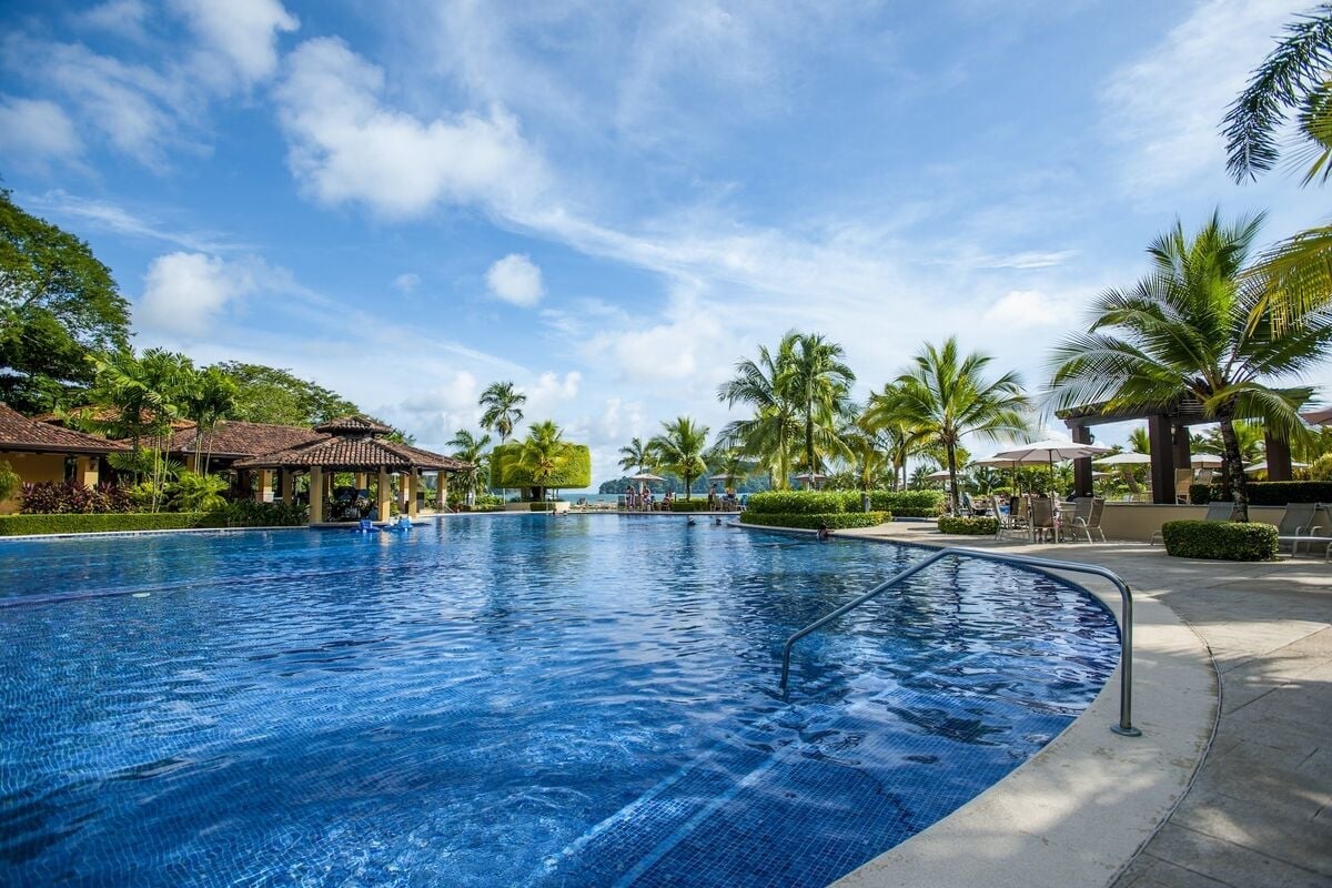los suenos resort pool oceanfront costa rica palm trees tropical setting