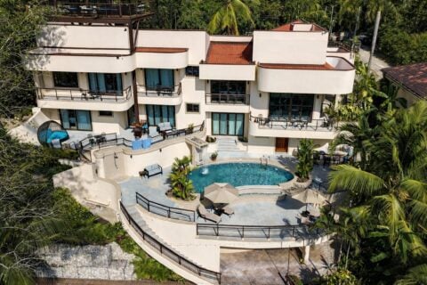 Aerial view of a luxury beachfront vacation villa with private pool on Costa Rica's Pacific coast