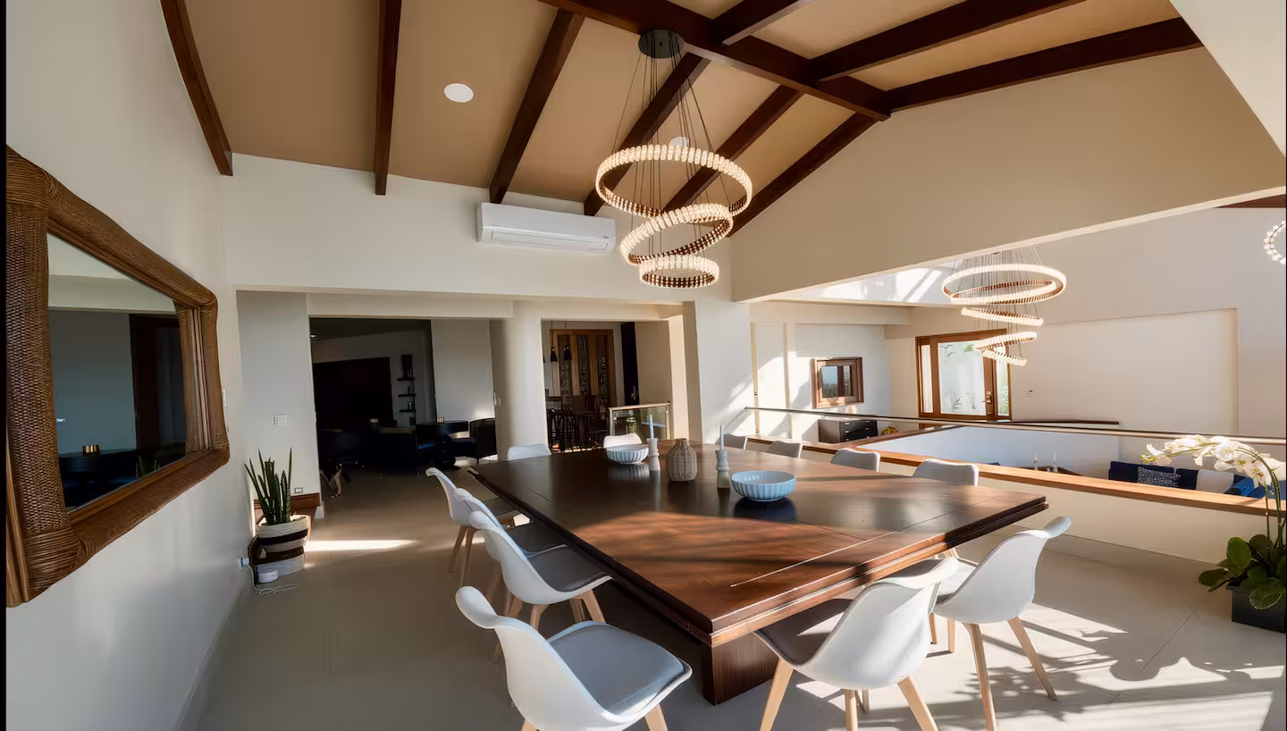 Open-concept dining room with vaulted ceilings in a luxury beachfront vacation villa in Costa Rica