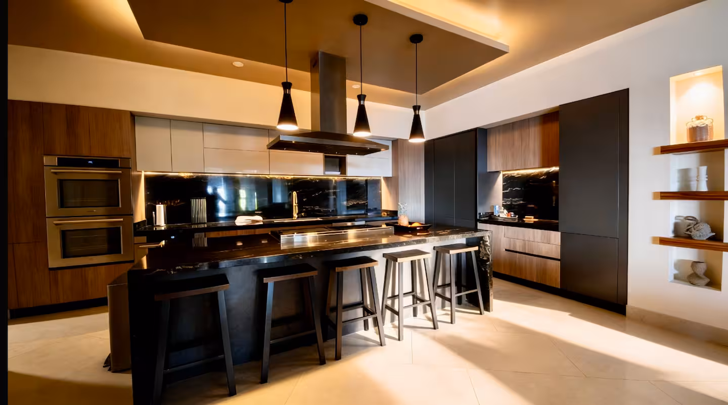 Contemporary gourmet kitchen with large island and bar in a luxury vacation villa in Costa Rica