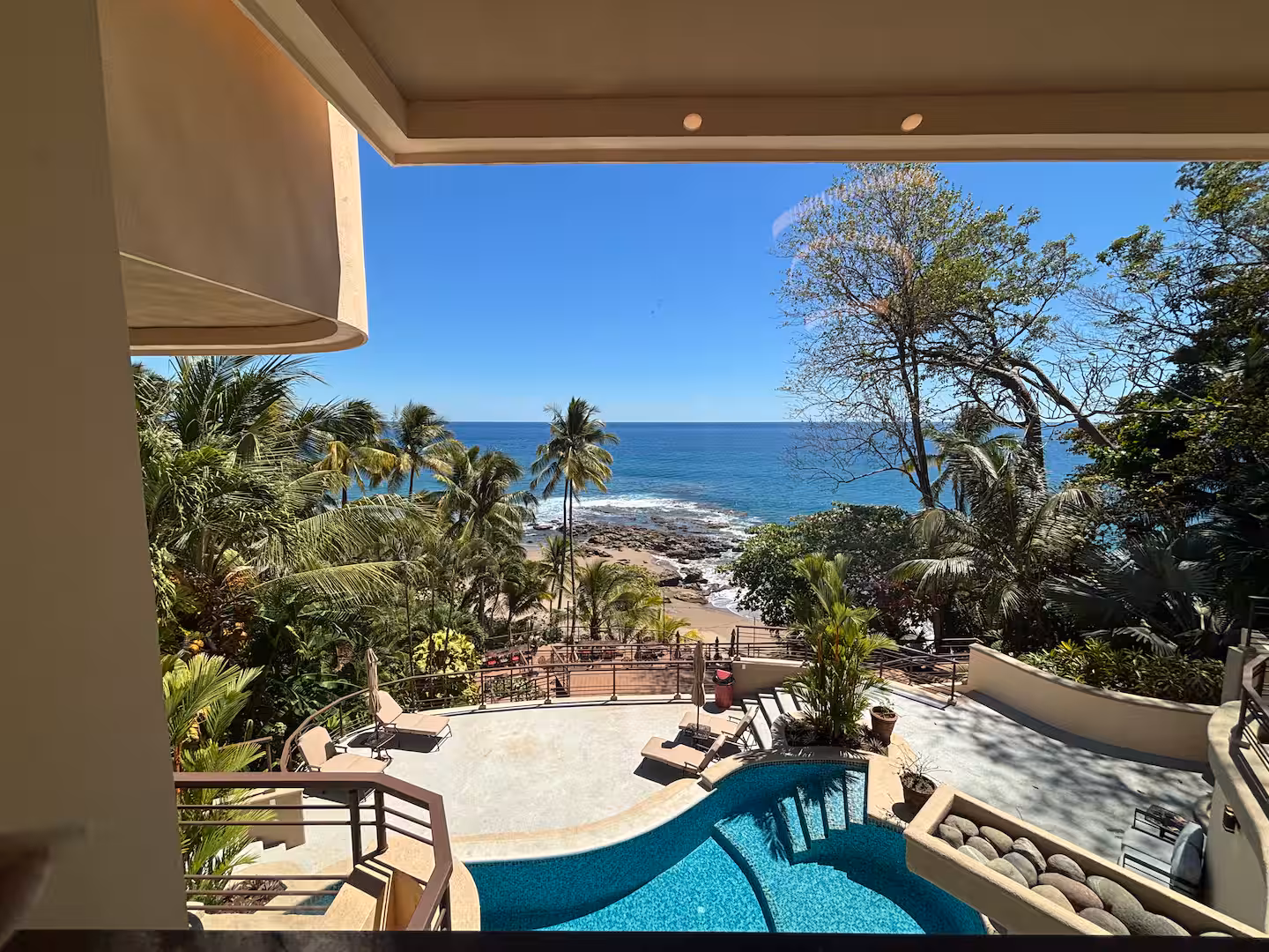 Ocean-view swimming pool overlooking the beach at a luxury vacation villa in Costa Rica